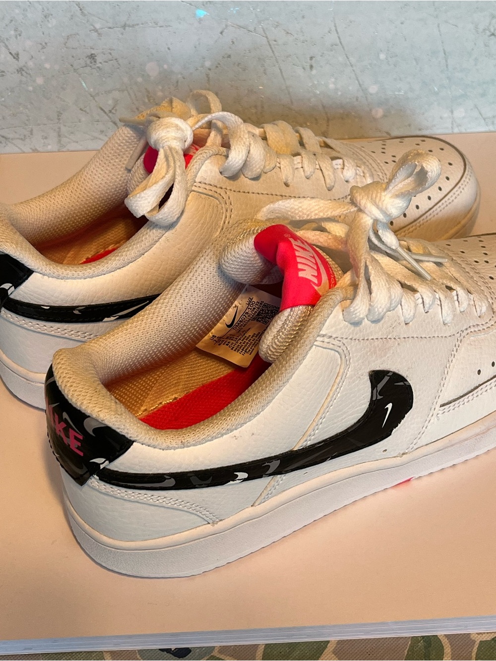 Women’s 7.5 Nike court vision with swooshfetti and camo bottoms